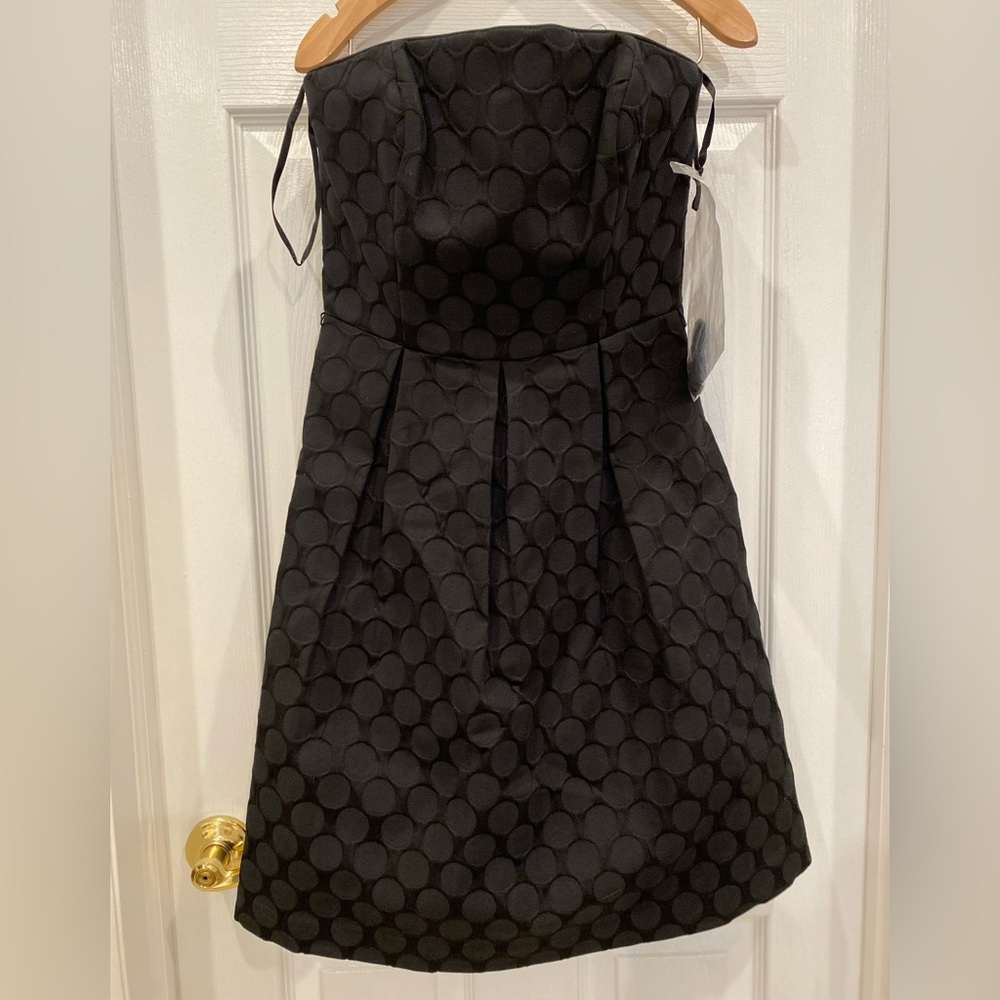 NWT White House Black Market size 0 black cocktail dress, with pockets